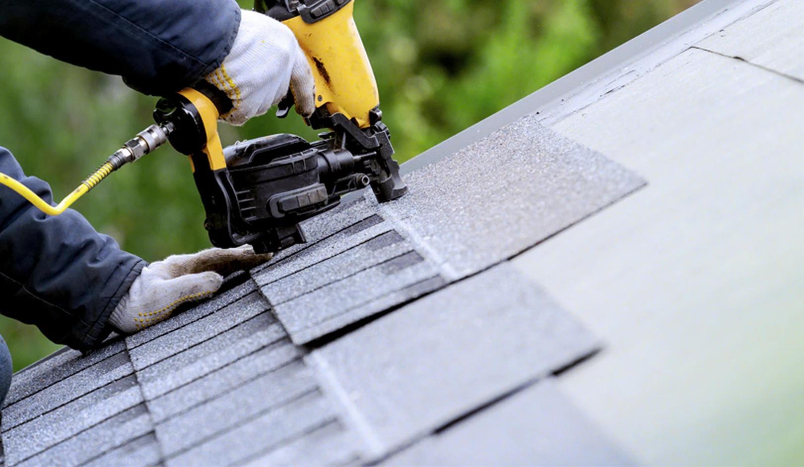Team repairing residential roof in New Berlin, WI after heavy rain, ensuring fast and skilled completion for local family